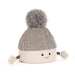 A plush novelty beanie hat with a gray cable-knit top, a cream ribbed bottom, a gray pom-pom, and small arms with mittens, shown on a white background.