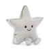 A silver glittery star-shaped plush toy with a smiling embroidered face and small feet, photographed on a clean white background.