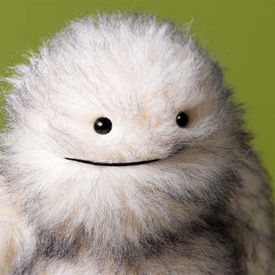 yetti stuffed animal on white background