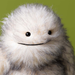 yetti stuffed animal on white background