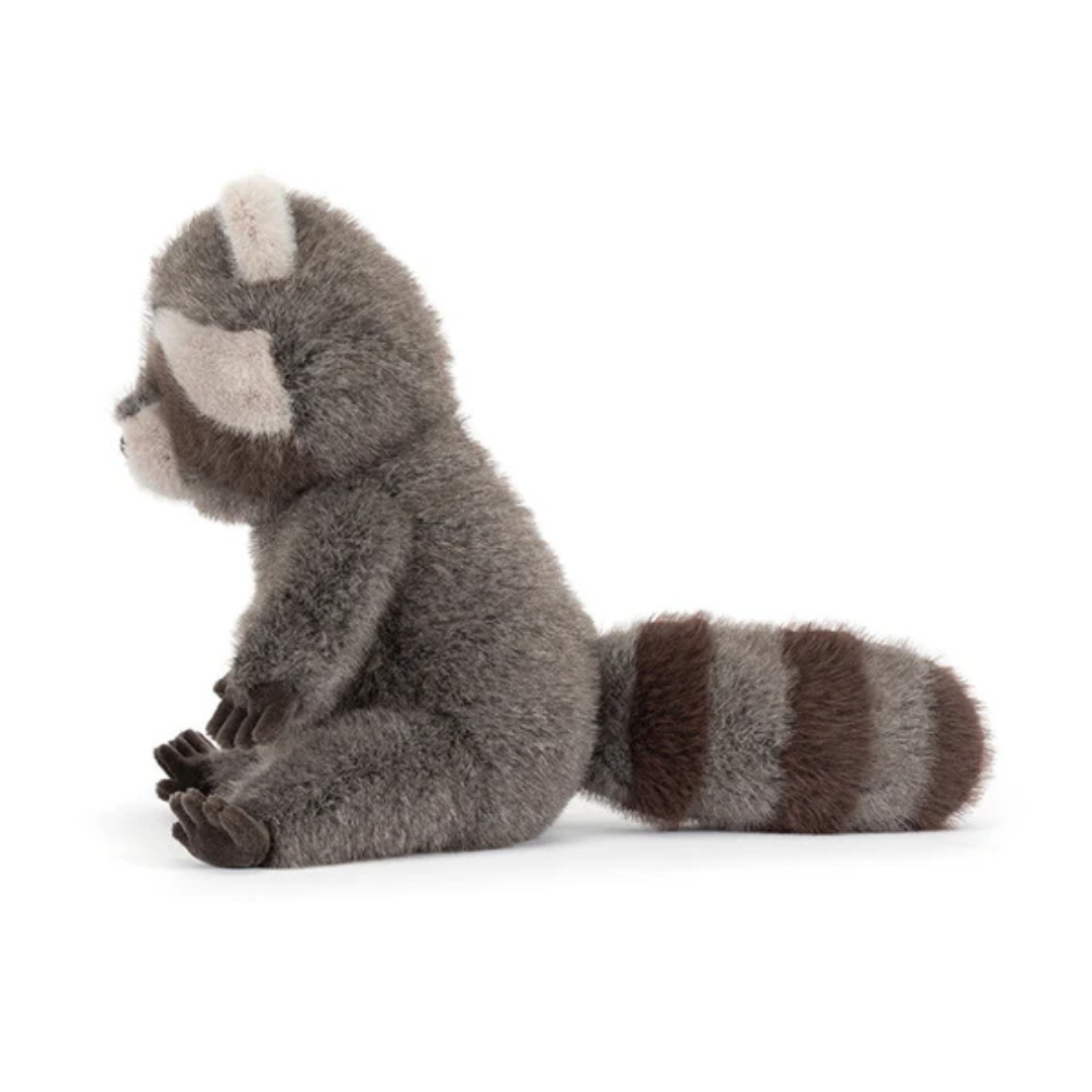 Plush raccoon toy on a white background