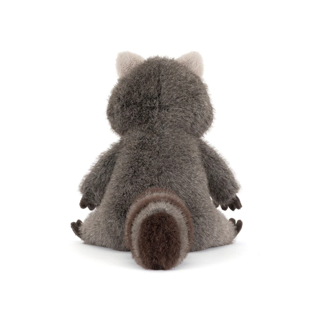 Plush raccoon toy on a white background