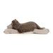 A plush stuffed animal shaped like a sleeping wolf or coyote, lying on its side with long floppy paws. The fur is primarily brown with a light beige muzzle, chest, and paw pads, photographed on a clean white background.