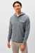 A man wearing a heather gray long-sleeve hooded henley shirt with a three-button placket and a chest pocket, paired with beige pants, against a plain light gray background.