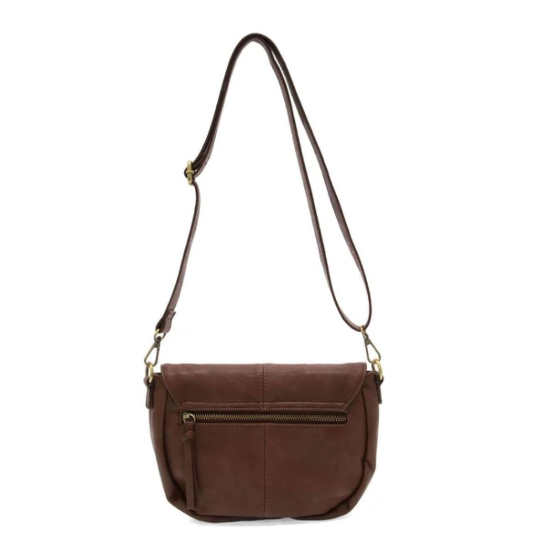 A brown faux-leather crossbody bag with a front zippered pocket and a long adjustable shoulder strap, shown against a plain white background.