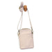 A small crossbody bag in light blush pink faux leather, hanging from a wooden peg on a white background.