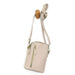 A small beige crossbody phone bag with a top zipper and a vertical zippered pocket, hanging from a wooden display stand against a white background.