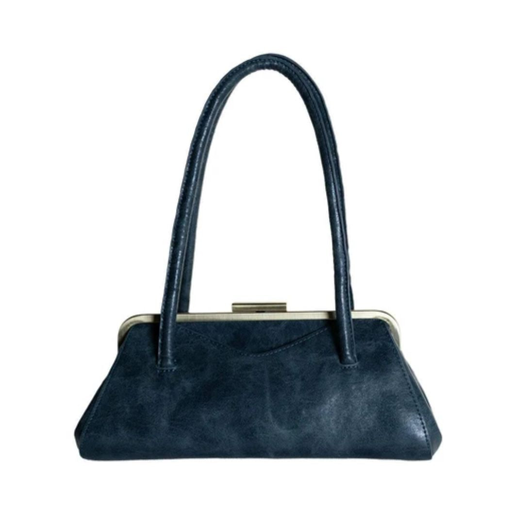 A dark navy blue faux leather handbag with a curved top handle, a kiss-lock metal frame, and a small gold-tone clasp, shown against a plain white background.