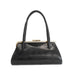 A black leather handbag with a curved top handle, a kiss-lock metal frame, and a gold-tone clasp, shown against a plain white background.