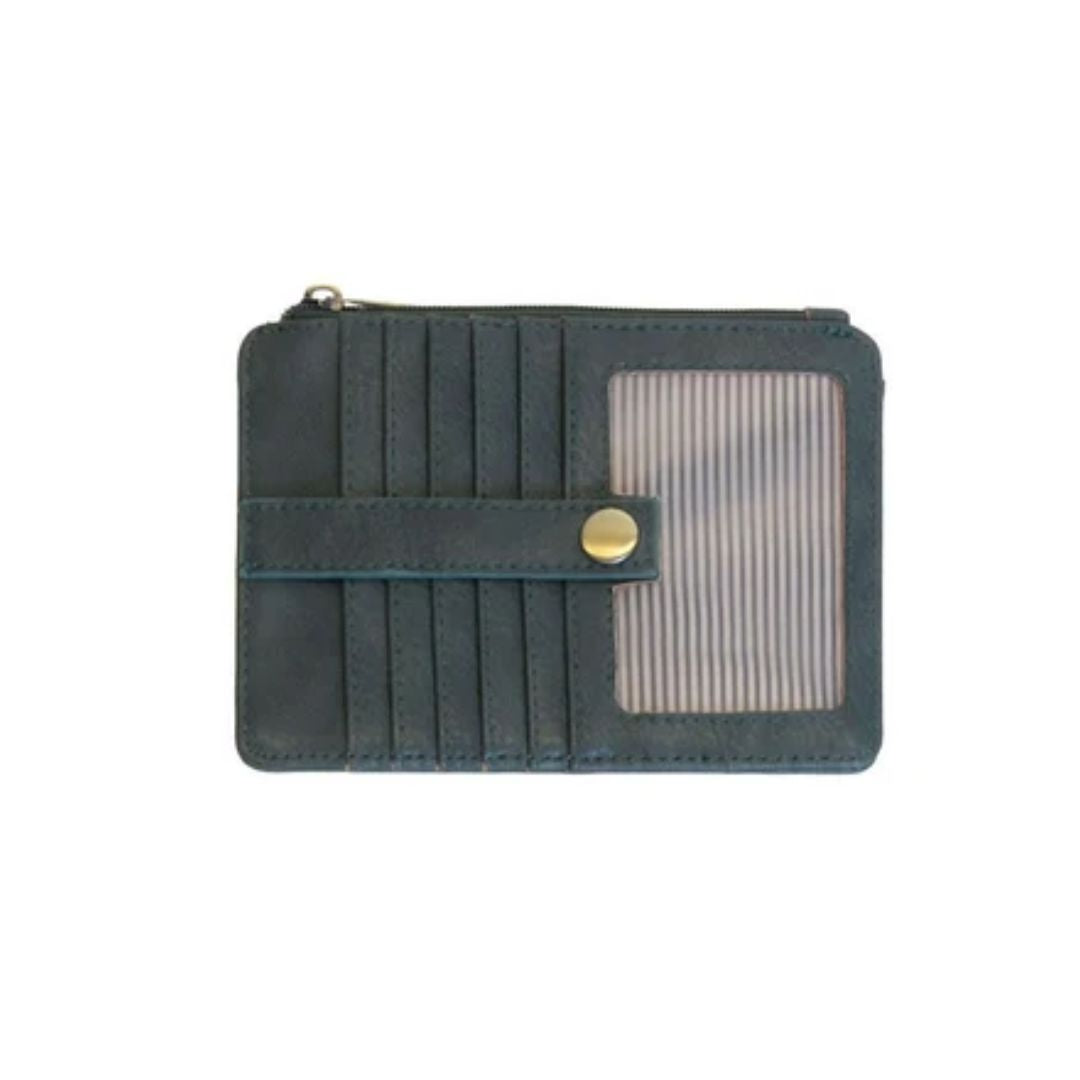 A dark teal card holder wallet with multiple card slots, a horizontal snap strap with a gold button, and a clear ID window on the right side, shown against a plain white background.