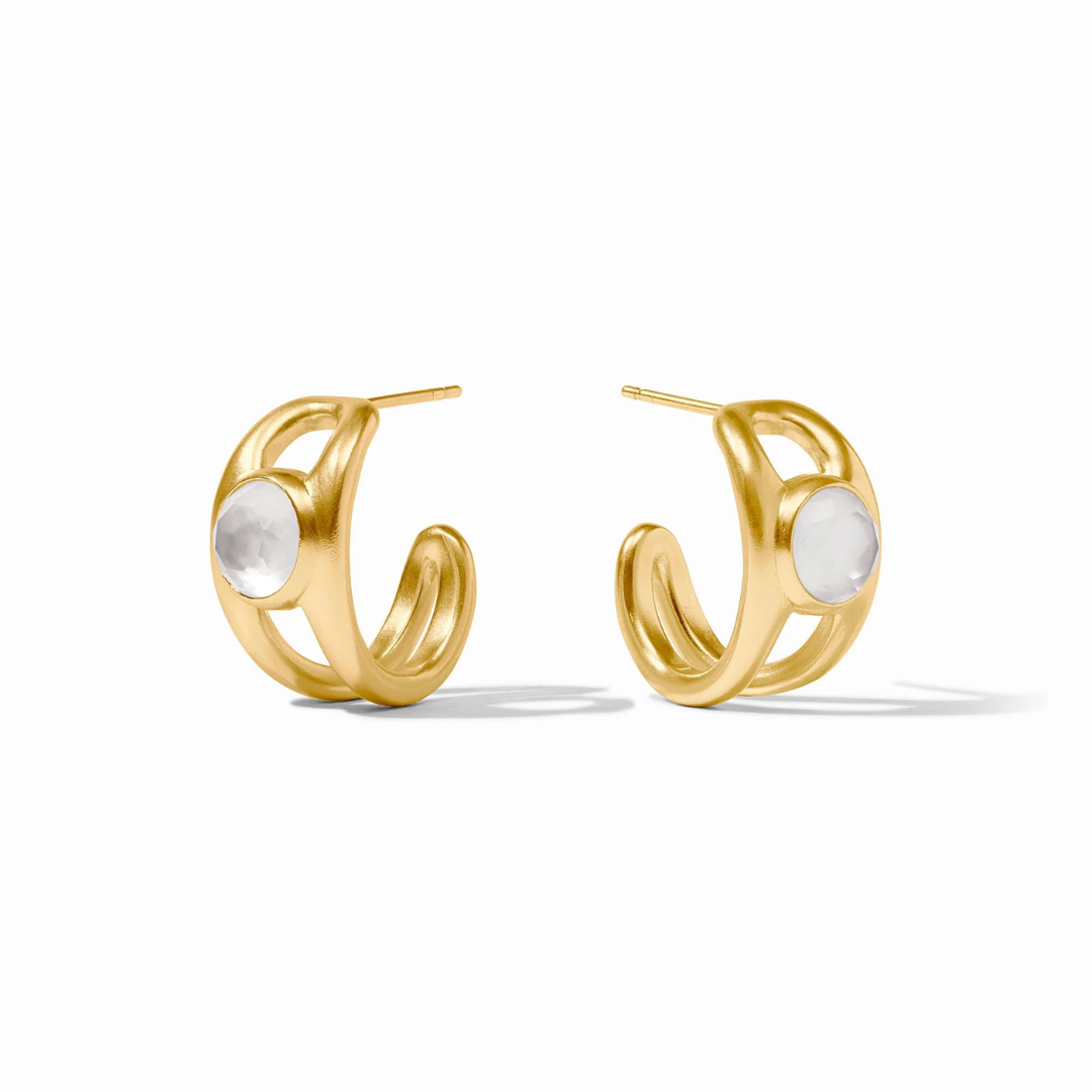 Gold hoop earrings with a central round gemstone on a white background