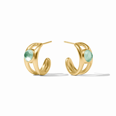 Gold hoop earrings with green gemstones on a white background