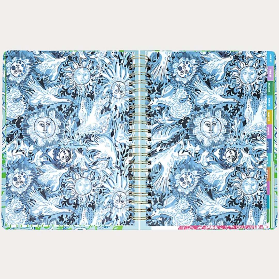 Open notebook with blue and white abstract design on a white background