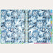 Open notebook with blue and white abstract design on a white background
