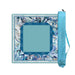 A JOKERS brand mahjong set shown on a white background, featuring a square game board with a blue and white shell-patterned border, a central teal playing field, and a matching teal carrying case with the JOKERS brand name printed on it.