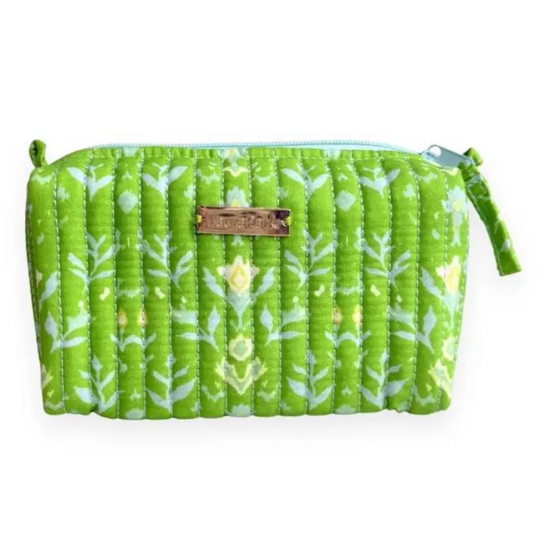 Green floral-patterned bags with matching pouch on a light background