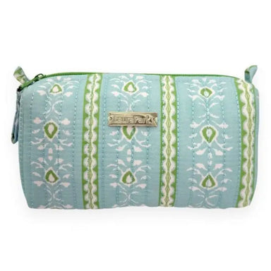 A light blue quilted cosmetic pouch with green and white vertical patterned stripes, featuring a gold-tone metal brand plaque.