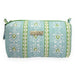 A light blue quilted cosmetic pouch with green and white vertical patterned stripes, featuring a gold-tone metal brand plaque.