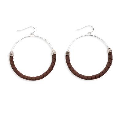 Pair of hoop earrings with brown and silver design on a white background