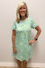 woman wearing blue and green dress with white shells