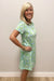 woman wearing blue and green dress with white shells