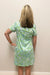 woman wearing blue and green dress with white shells