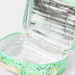 An open insulated lunch bag with a mint green and green floral pattern exterior, a beige handle, and a reflective silver foil lining.