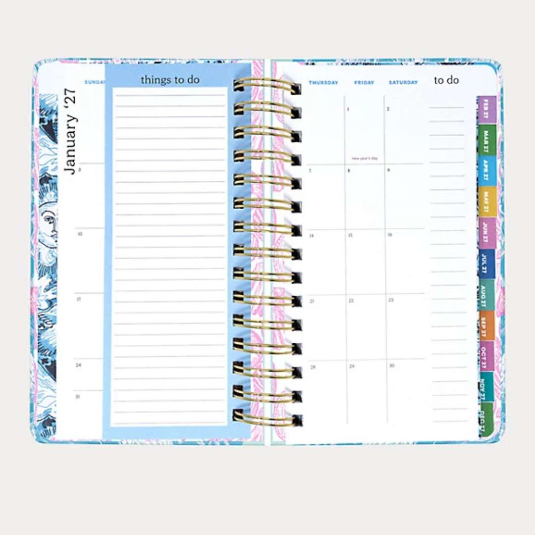 Planner with colorful tabs on a white background
