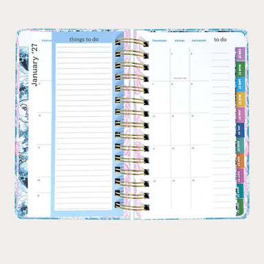 Planner with colorful tabs on a white background