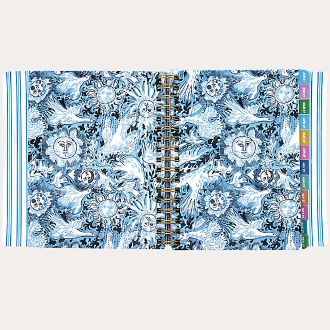 Notebook with celestial design on cover and spine on a white background