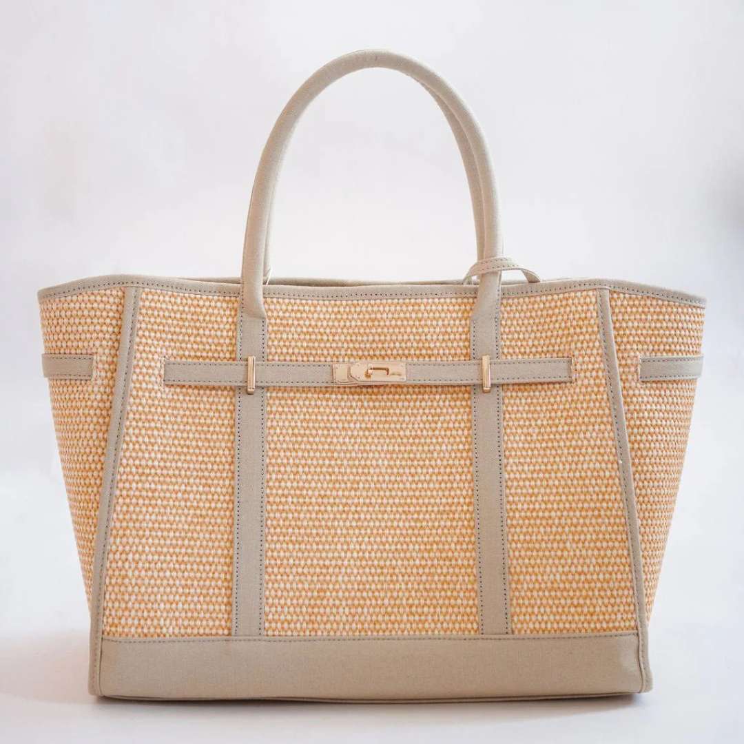 Woven handbag with beige trim on a white background