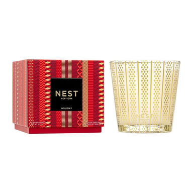 A NEST New York 'Holiday' scented candle shown with its red and gold patterned packaging box on a clean white background.