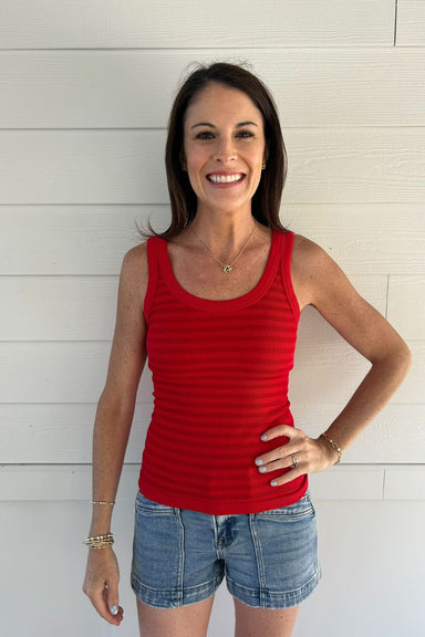 woman with red tank top on white background