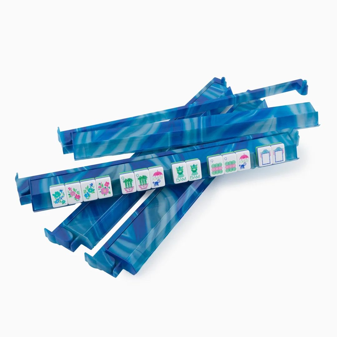 Blue marbled plastic mahjong tile racks holding several white and multicolored mahjong tiles, photographed on a clean white background.