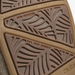 Close-up of a brown textured shoe sole showing embossed leaf-like tread patterns and text reading 'NON-MARKING' and 'WET GRIP RUBBER'.