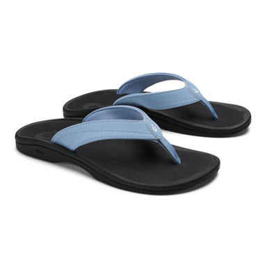 Pair of black and blue sandals on a white background