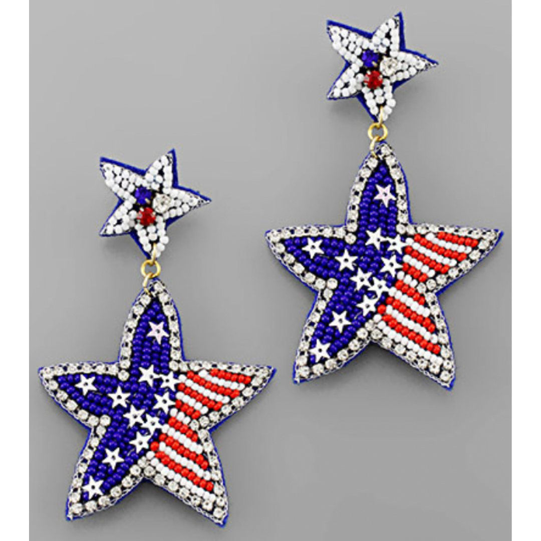 Star-shaped earrings with American flag design on a gray background