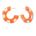 Pair of orange hoop earrings on a white background