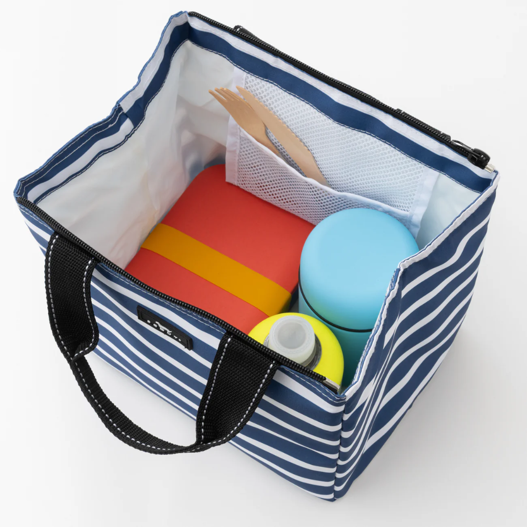 Blue and white striped tote bag with colorful items on a white background