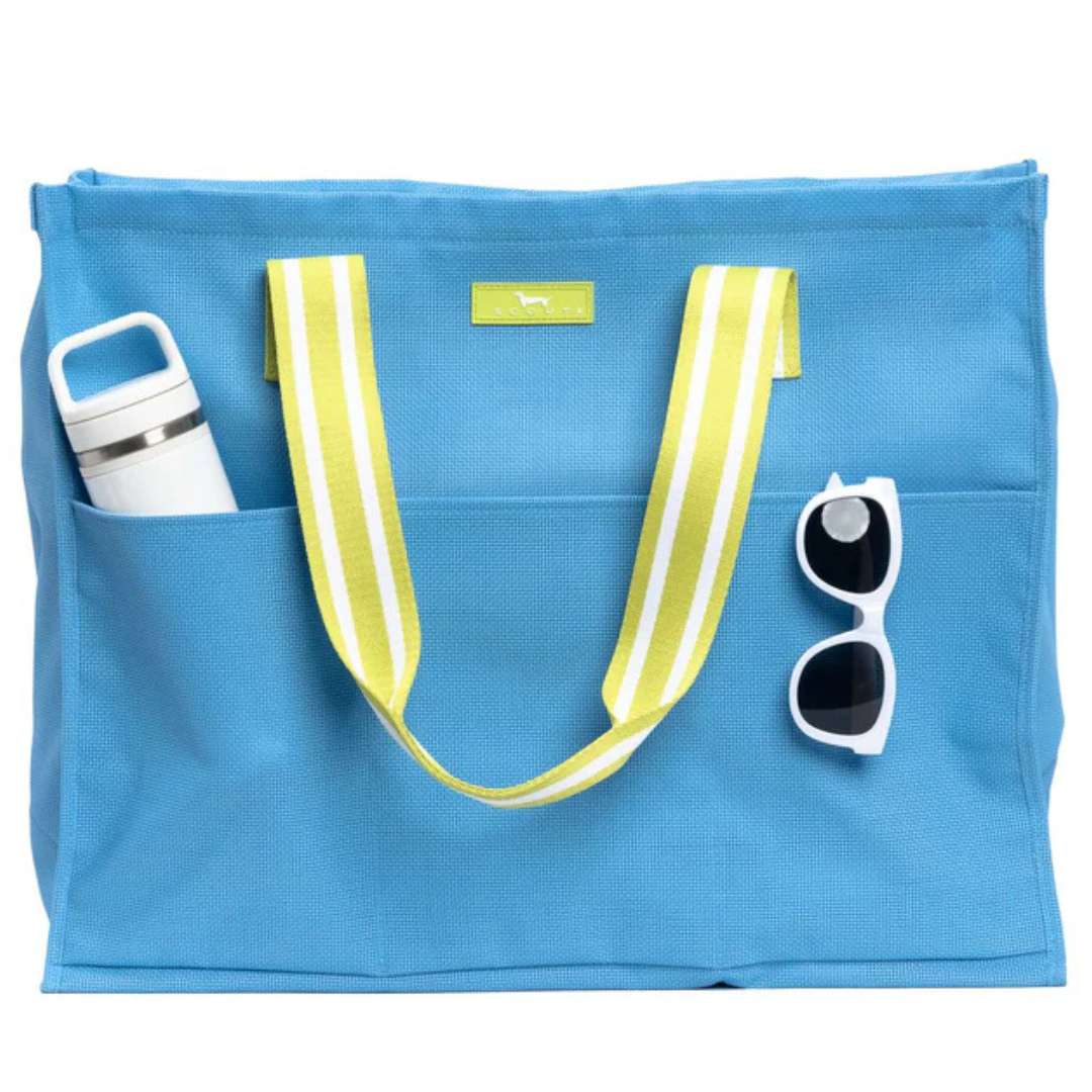 Blue tote bag with yellow straps, water bottle, and sunglasses on a white background