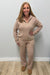 Woman wearing Softies Cable Knit Marshmallow 1/2 Zip with Tapered Pant Coco on a plain white background.