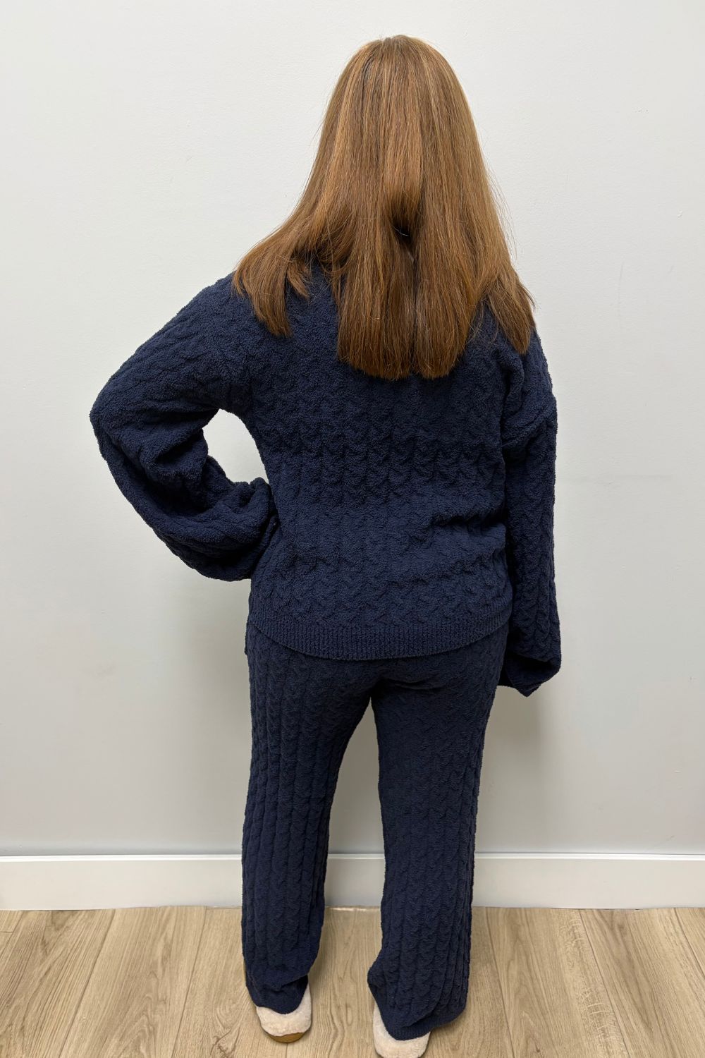 Woman wearing Softies Cable Knit Marshmallow V-Neck with Flared Sleeve and Pant Midnight on a plain white background.