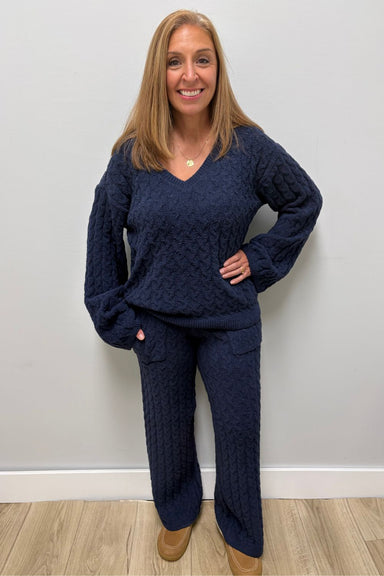 Woman wearing Softies Cable Knit Marshmallow V-Neck with Flared Sleeve and Pant Midnight on a plain white background.