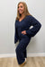 Woman wearing Softies Cable Knit Marshmallow V-Neck with Flared Sleeve and Pant Midnight on a plain white background.