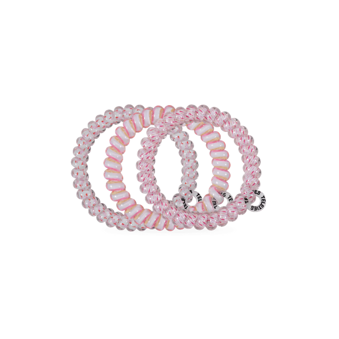 pink hair tie on white background