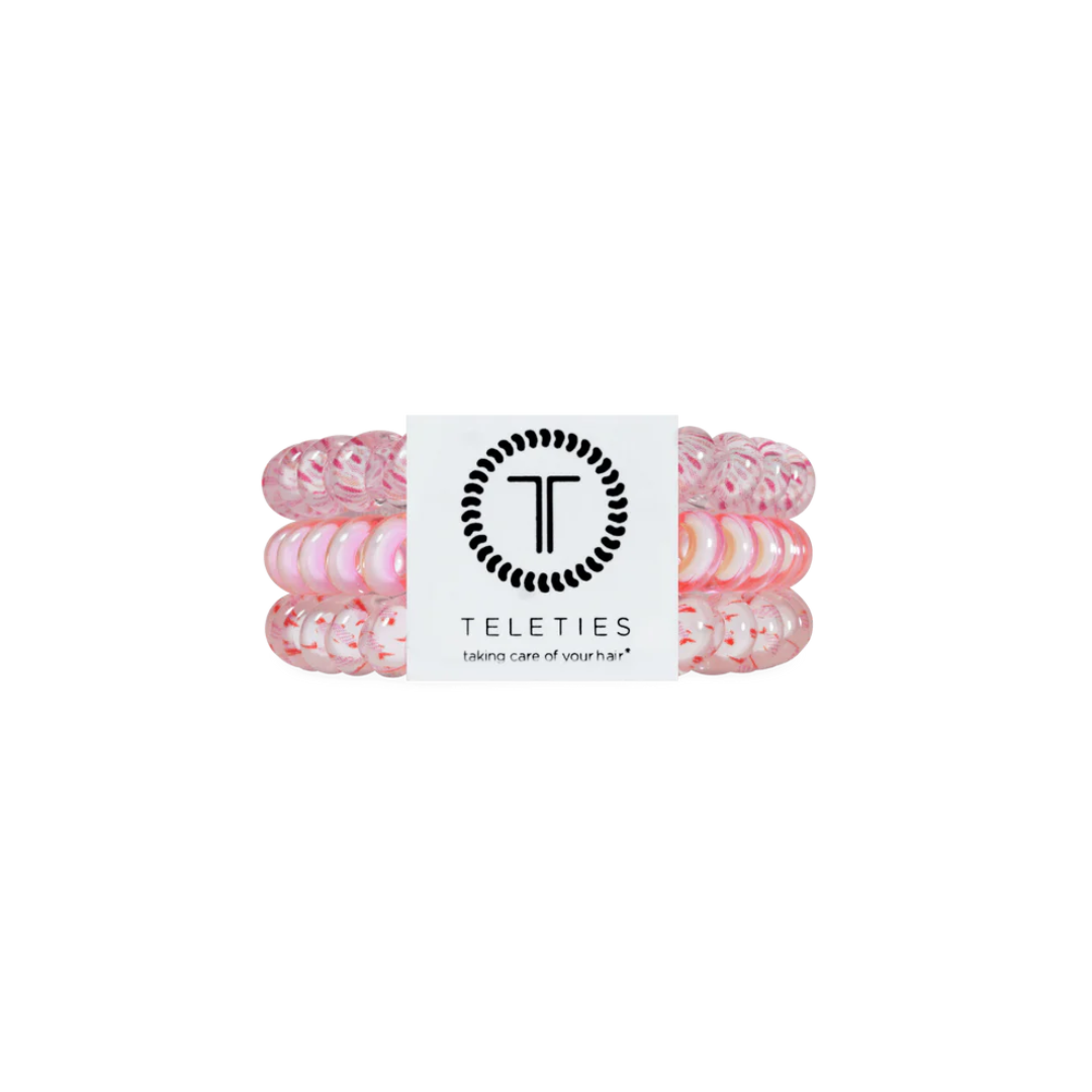 pink hair tie on white background
