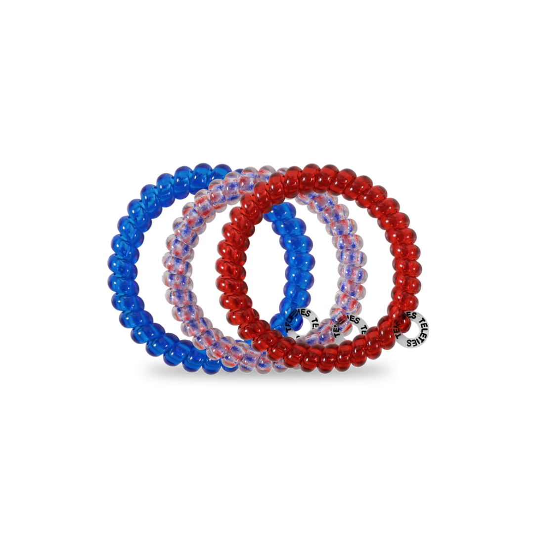 red white and blue hair ties against white background
