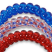 red white and blue hair ties against white background