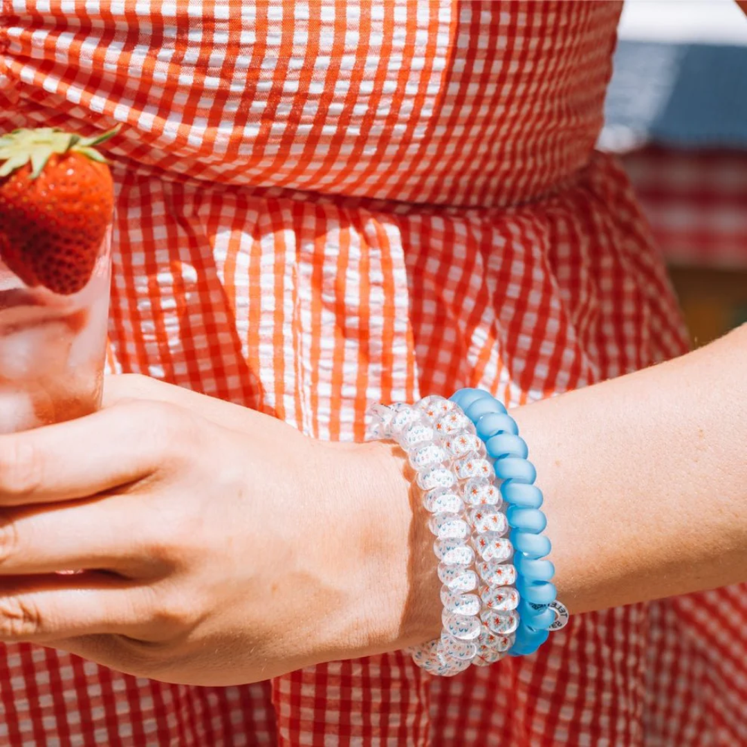 red white and blue hairties on model wrist 
