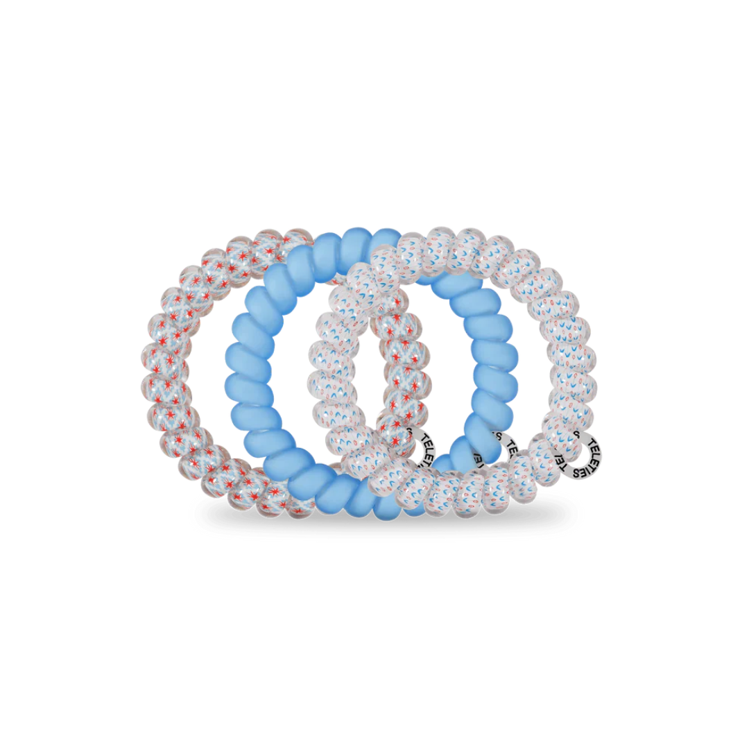group of red white and blue hair ties on white background 
